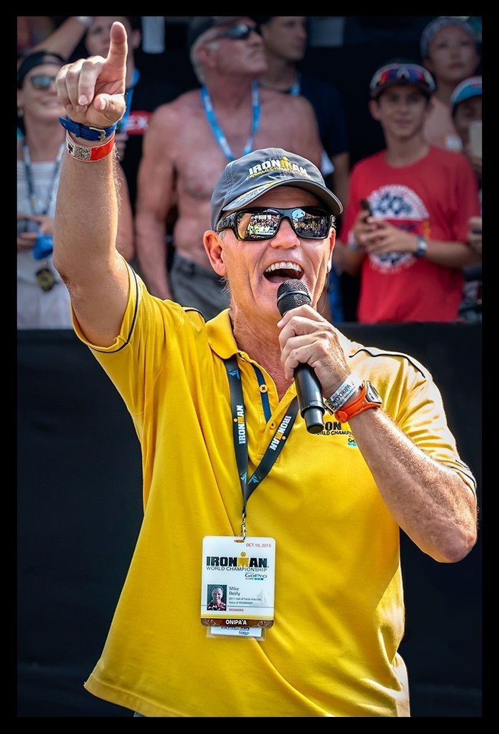 mike reilly ironman hawaii kona yellow shirt microfon sunglas cheering crowd